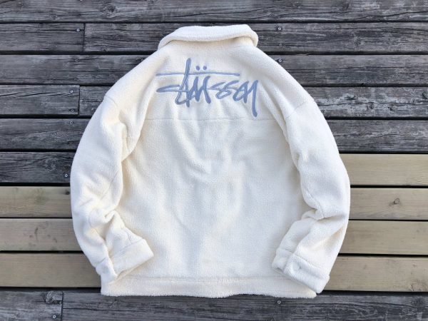 Stussy sudadera con capucha de forro polar con logo estampado en blanco y negro